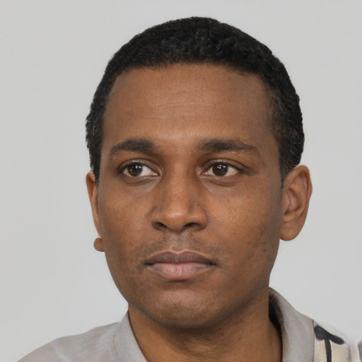 Neutral black young-adult male with short  black hair and brown eyes