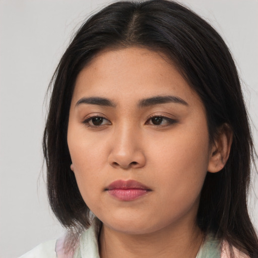 Neutral asian young-adult female with medium  brown hair and brown eyes