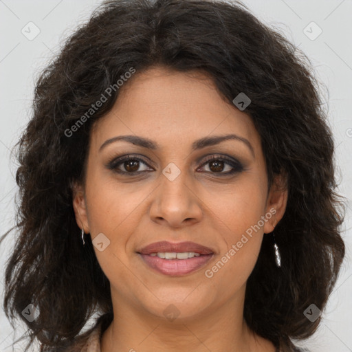 Joyful white adult female with long  brown hair and brown eyes