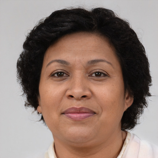 Joyful latino adult female with short  brown hair and brown eyes