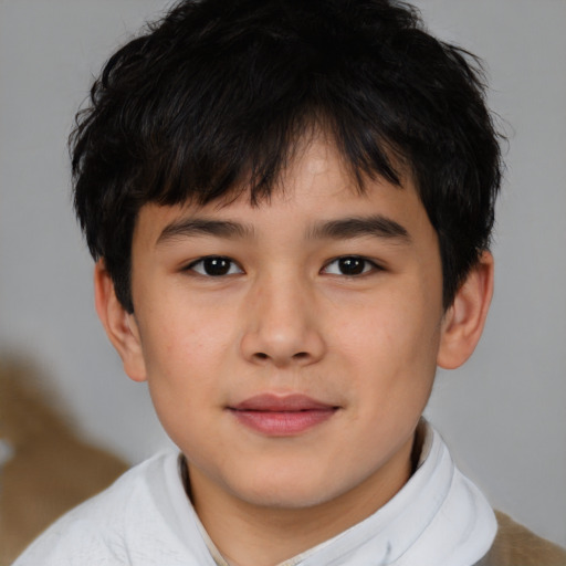 Joyful asian child male with short  brown hair and brown eyes