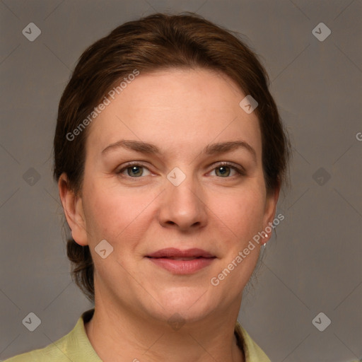 Joyful white adult female with short  brown hair and grey eyes