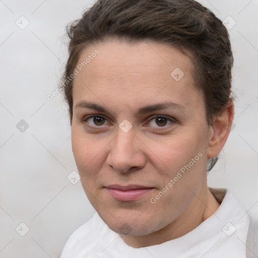 Joyful white young-adult female with short  brown hair and brown eyes