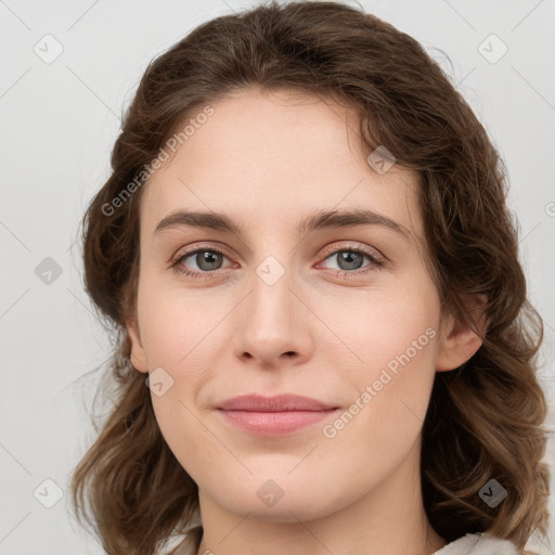 Joyful white young-adult female with medium  brown hair and green eyes