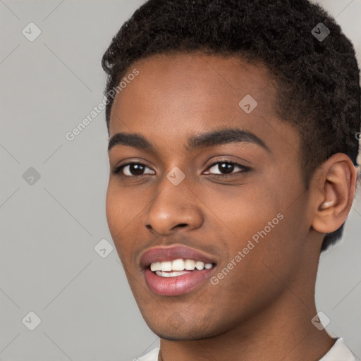 Joyful black young-adult male with short  brown hair and brown eyes