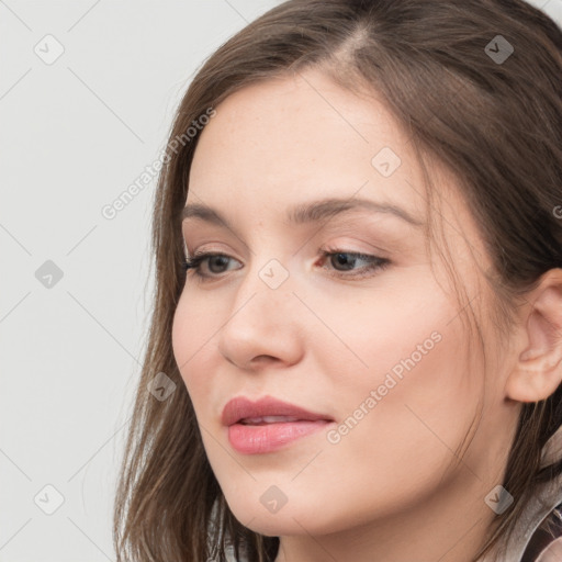 Neutral white young-adult female with long  brown hair and brown eyes