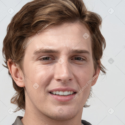 Joyful white young-adult male with medium  brown hair and grey eyes