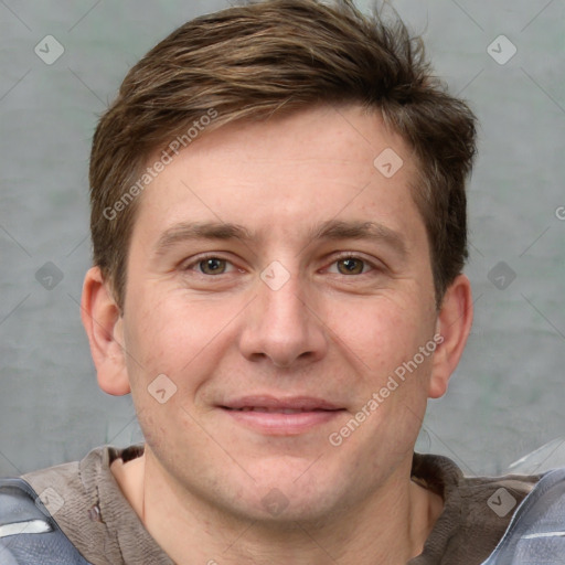 Joyful white adult male with short  brown hair and grey eyes