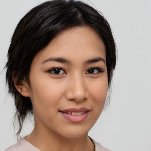 Joyful white young-adult female with medium  black hair and brown eyes