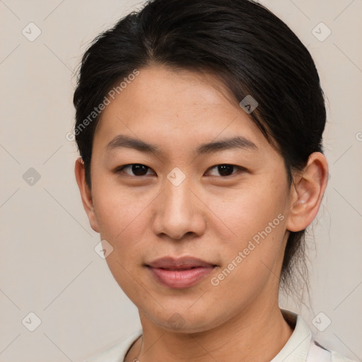 Joyful asian young-adult female with short  brown hair and brown eyes