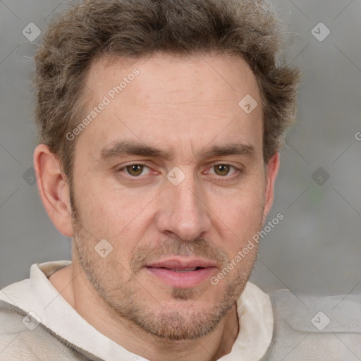 Joyful white adult male with short  brown hair and grey eyes