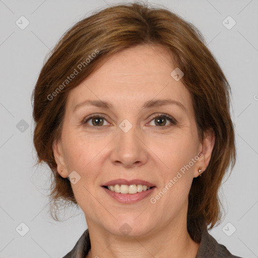 Joyful white adult female with medium  brown hair and grey eyes