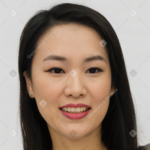 Joyful asian young-adult female with long  brown hair and brown eyes