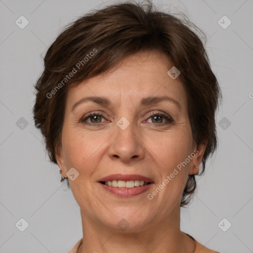 Joyful white adult female with short  brown hair and brown eyes