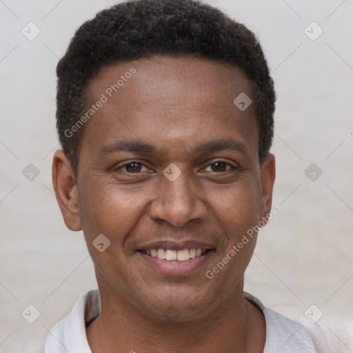 Joyful latino young-adult male with short  brown hair and brown eyes