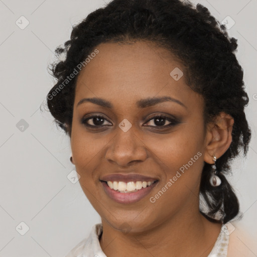 Joyful black young-adult female with medium  black hair and brown eyes