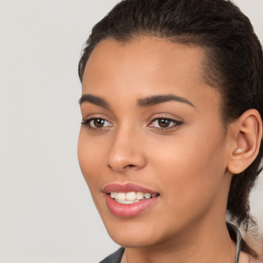 Joyful latino young-adult female with short  brown hair and brown eyes