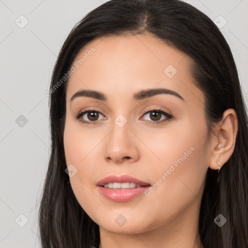 Joyful white young-adult female with long  black hair and brown eyes