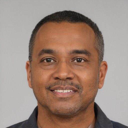 Neutral black adult male with short  black hair and brown eyes
