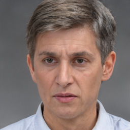 Neutral white middle-aged male with short  brown hair and brown eyes