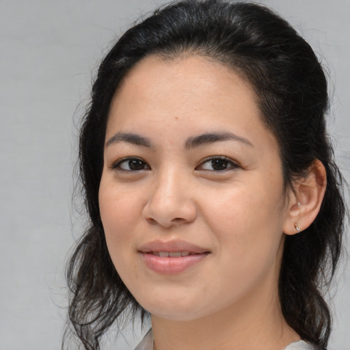 Joyful asian young-adult female with medium  brown hair and brown eyes