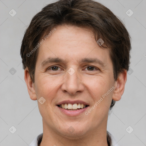 Joyful white adult male with short  brown hair and brown eyes