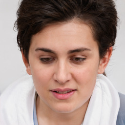 Joyful white young-adult female with medium  brown hair and brown eyes