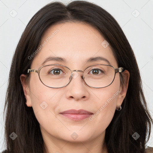 Joyful white adult female with long  brown hair and brown eyes