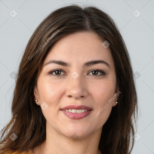 Joyful white young-adult female with long  brown hair and brown eyes