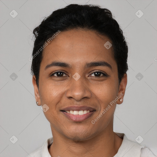 Joyful latino young-adult female with short  black hair and brown eyes