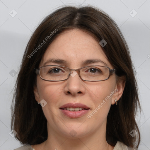 Joyful white adult female with medium  brown hair and grey eyes