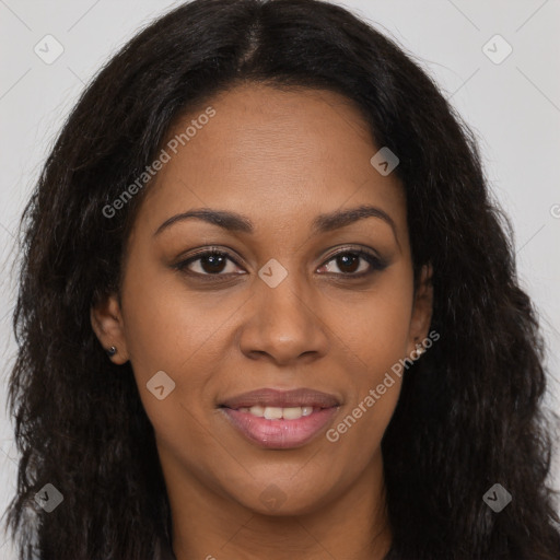 Joyful black young-adult female with long  brown hair and brown eyes