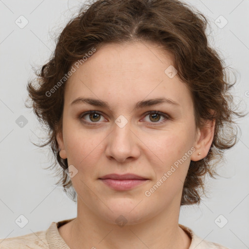 Joyful white young-adult female with medium  brown hair and green eyes