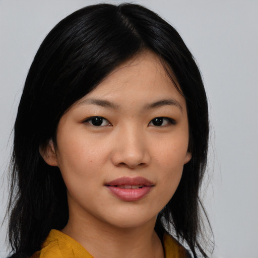 Joyful asian young-adult female with medium  black hair and brown eyes
