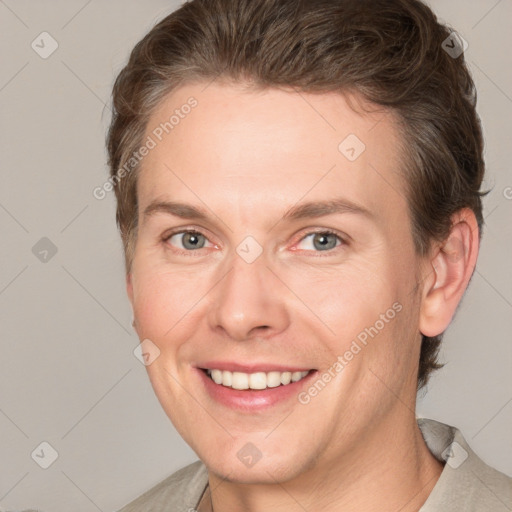 Joyful white adult female with short  brown hair and grey eyes