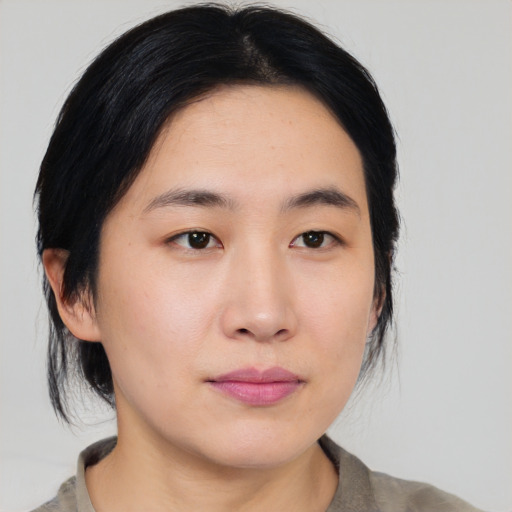 Neutral asian young-adult female with medium  black hair and brown eyes