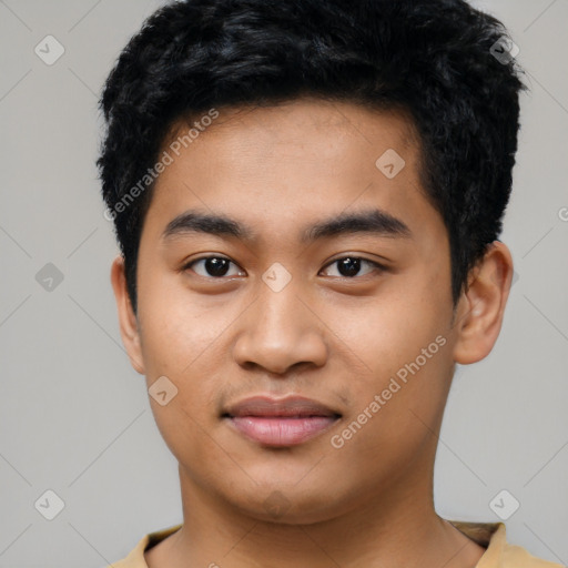 Joyful asian young-adult male with short  black hair and brown eyes