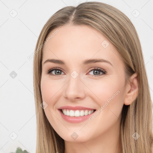 Joyful white young-adult female with long  brown hair and green eyes