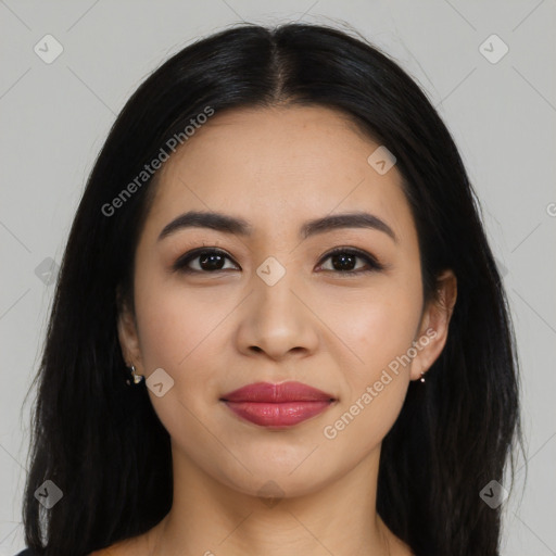 Joyful latino young-adult female with long  black hair and brown eyes