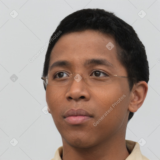 Neutral latino young-adult male with short  black hair and brown eyes