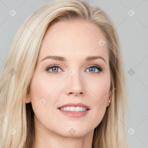 Joyful white young-adult female with long  brown hair and blue eyes