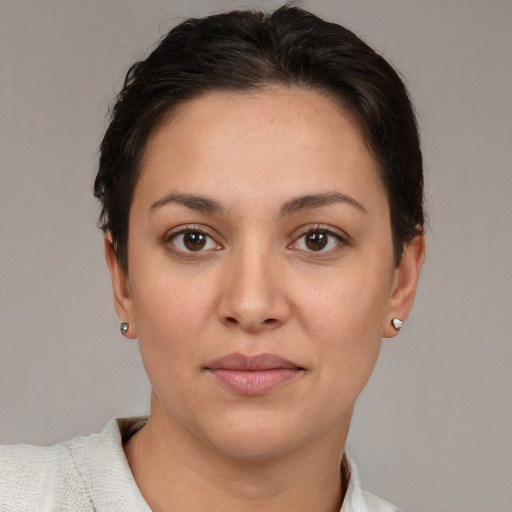 Joyful white young-adult female with short  brown hair and brown eyes