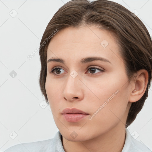 Neutral white young-adult female with short  brown hair and brown eyes