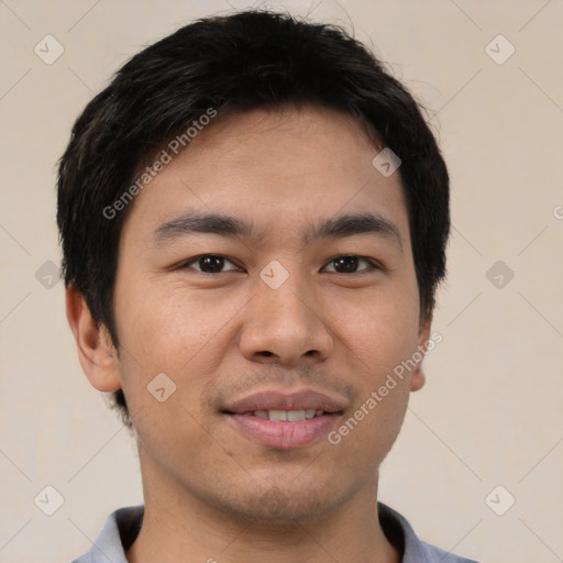 Joyful asian young-adult male with short  black hair and brown eyes