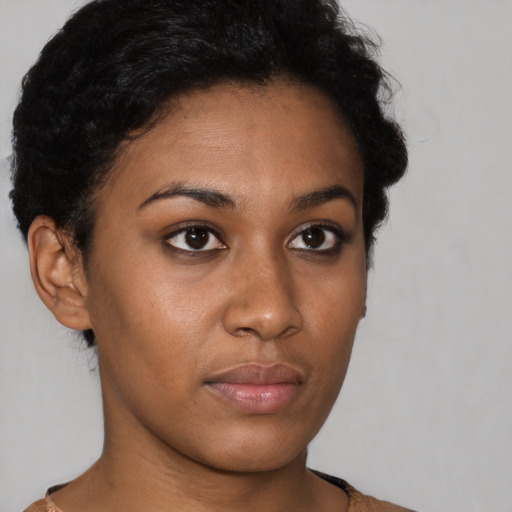 Neutral black young-adult female with short  brown hair and brown eyes