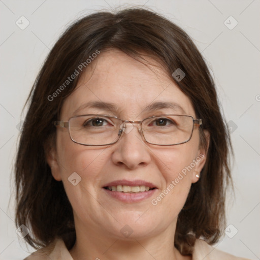 Joyful white adult female with medium  brown hair and grey eyes