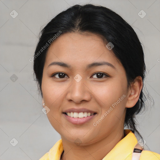 Joyful asian young-adult female with medium  brown hair and brown eyes