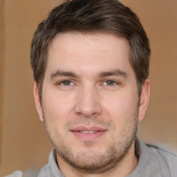 Joyful white adult male with short  brown hair and brown eyes