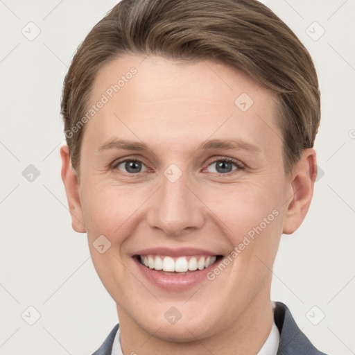 Joyful white young-adult female with short  brown hair and grey eyes