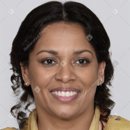 Joyful latino adult female with medium  brown hair and brown eyes